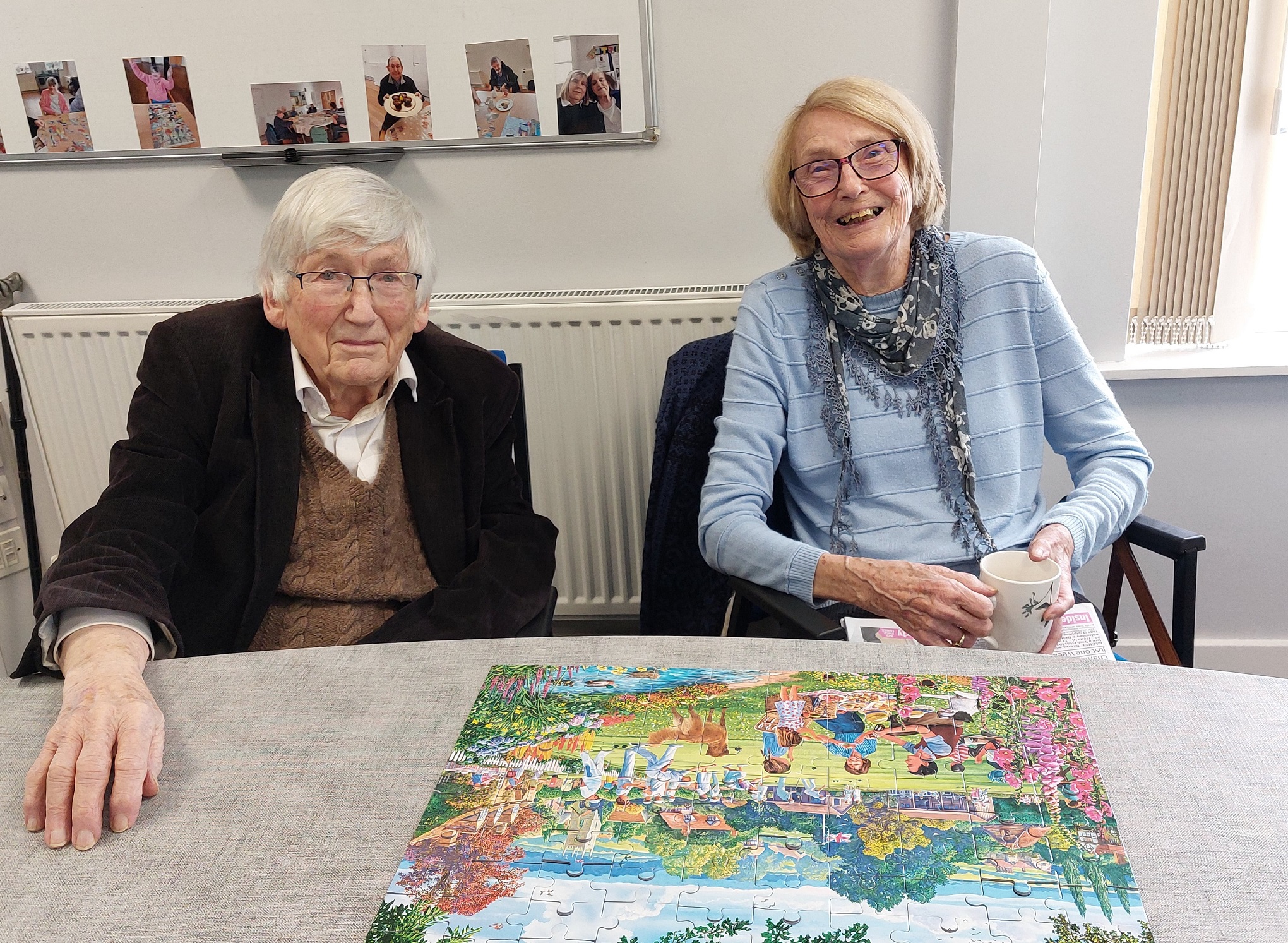 Two people doing a jigsaw puzzle at a social day club for older people in Harrogate